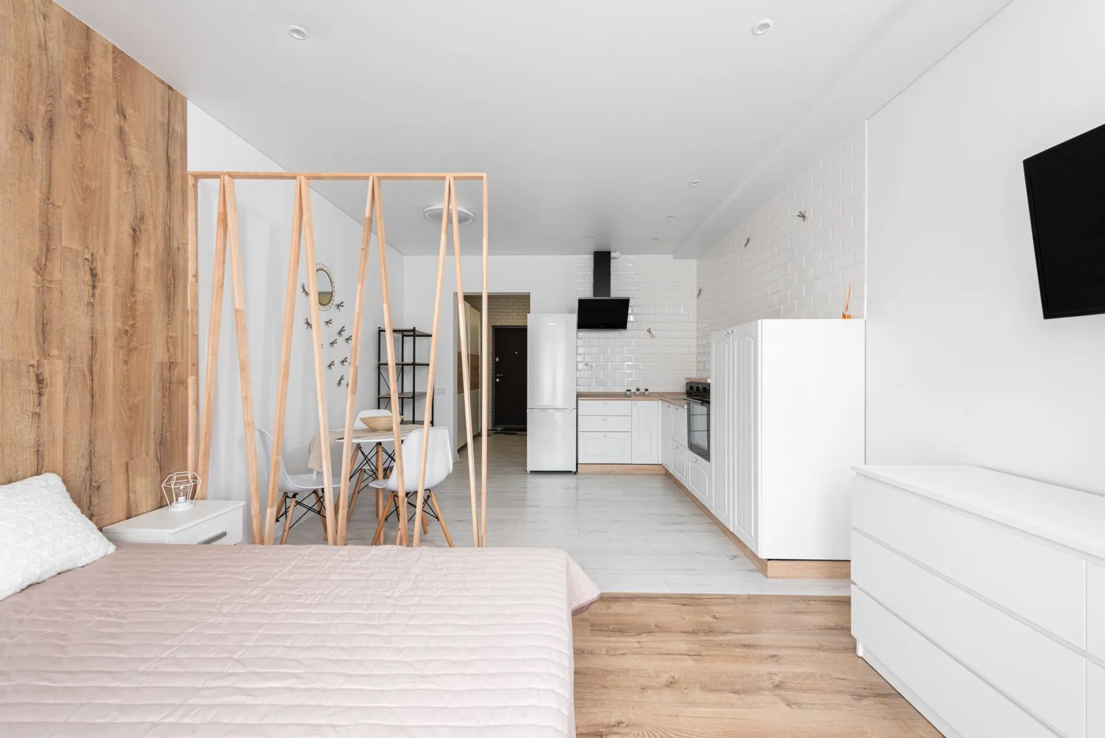 Bright, furnished studio apartment with a large window
